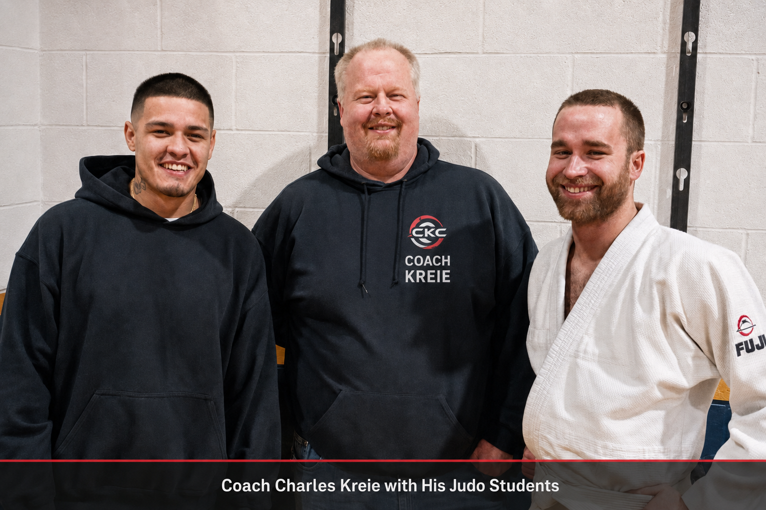 Coach Charles Kreie standing with two adult judo students at CKC Martial Arts.